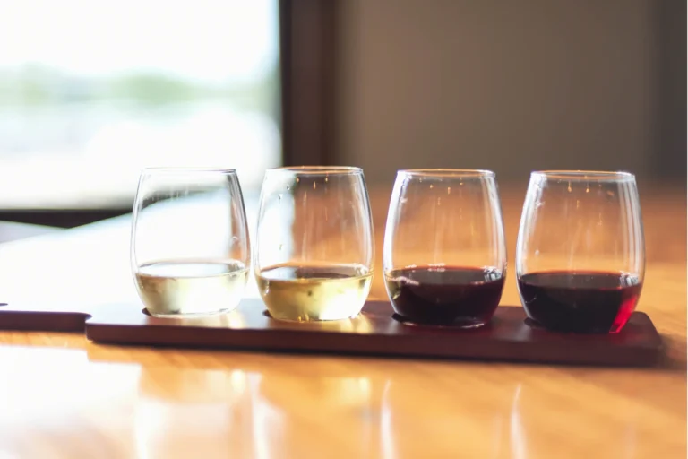 4 wine glasses at a tasting.