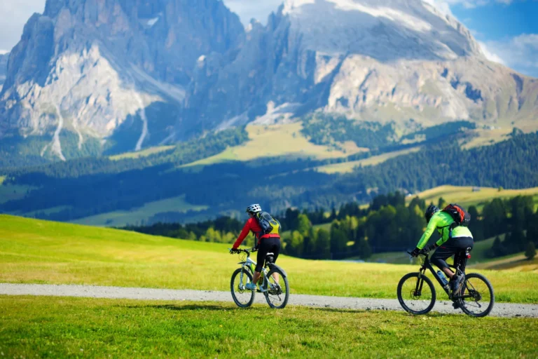 Cyclists in Seiser Alm - High altitude meadow.
