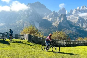 Cyclists with view of Brenta Dolomites.