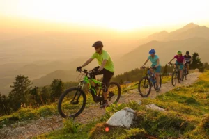 Family cycling on mountain trail.