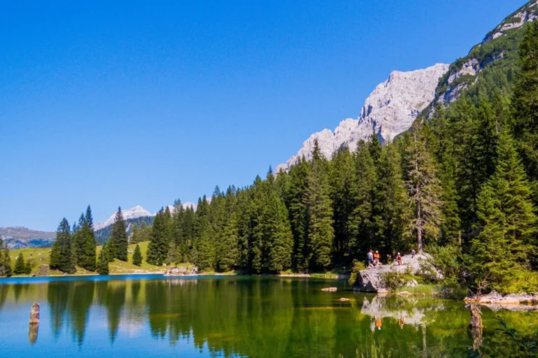 Hikers at Lago Valagola near Pinzolo, Trentino.