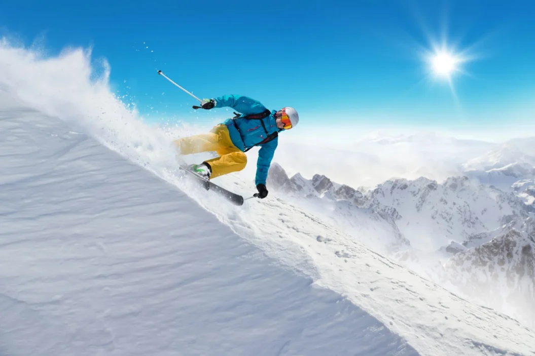 Off-piste skier with mountain peaks in the distance