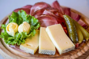 South Tyrol food - Speck, lagrein washed-rind cheese and pickle.