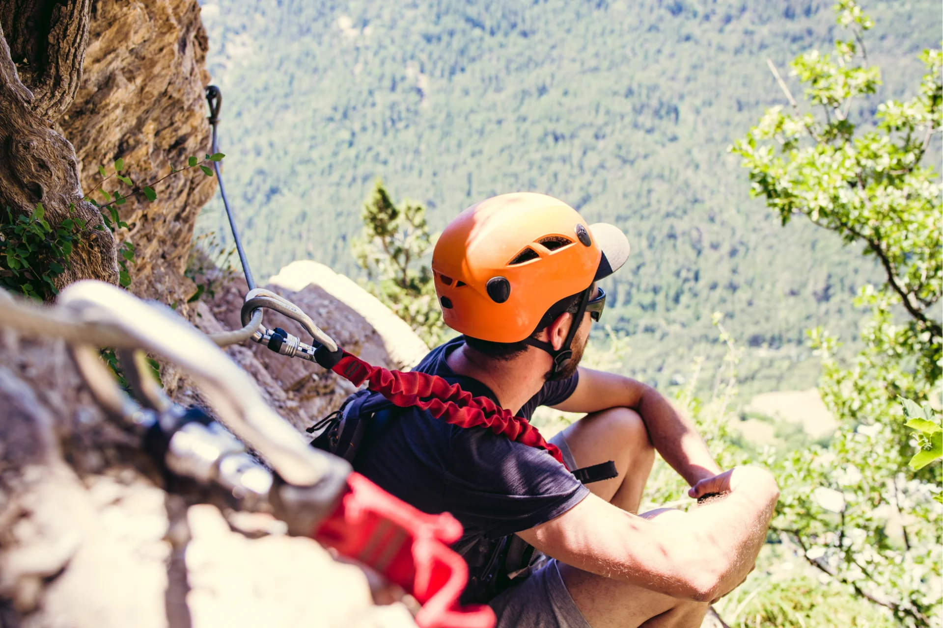 Taking a rest and enjoying the view - all part of the via ferrata experience.