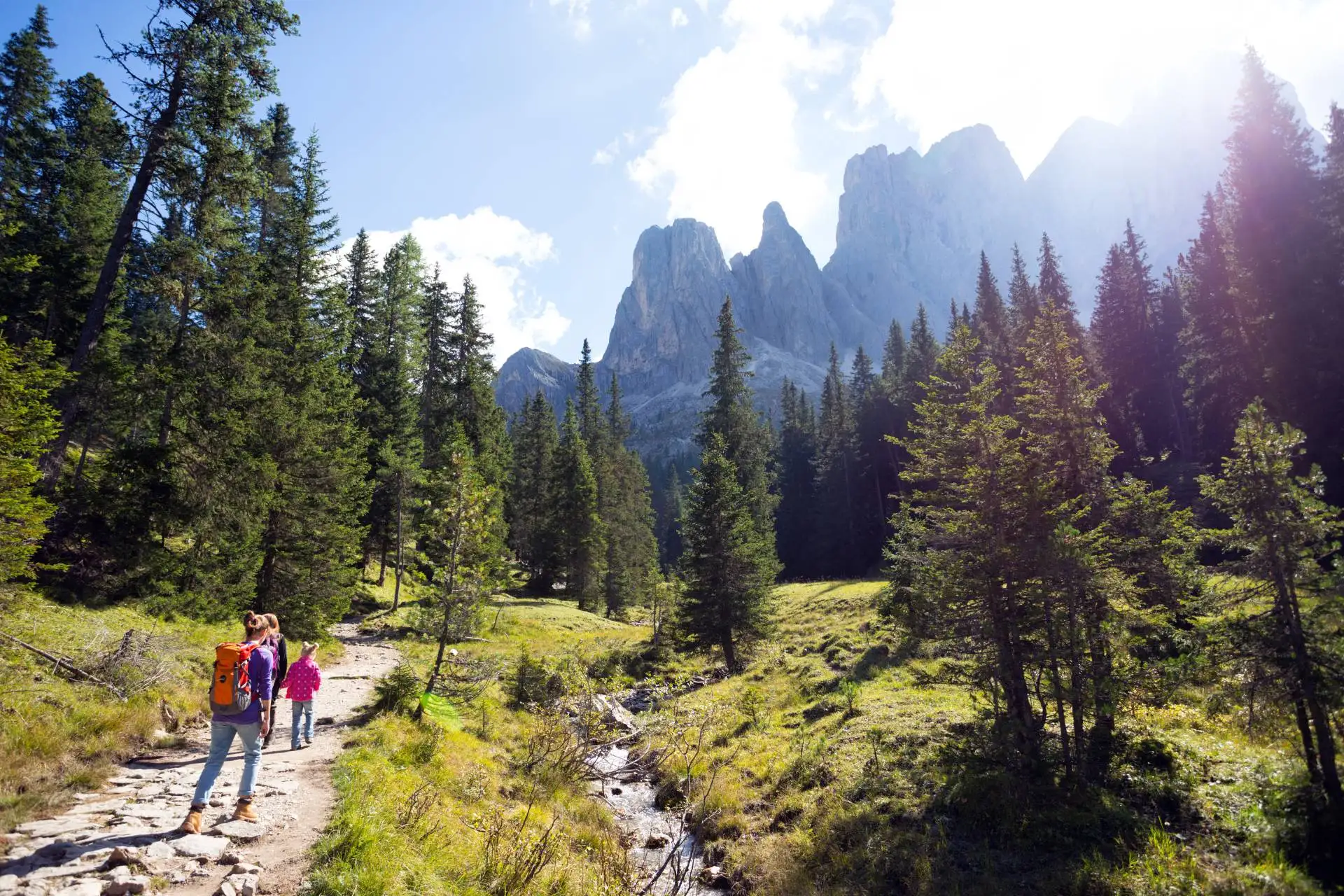 Hiking alongside a stream at Puez-Odle: