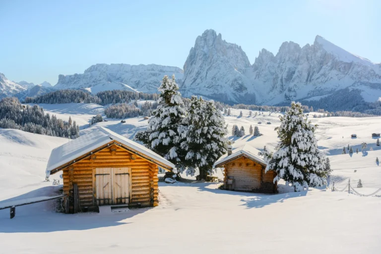 Log cabin in the snow at Alpe di Siusi (Seiser Alm), Dolomites.