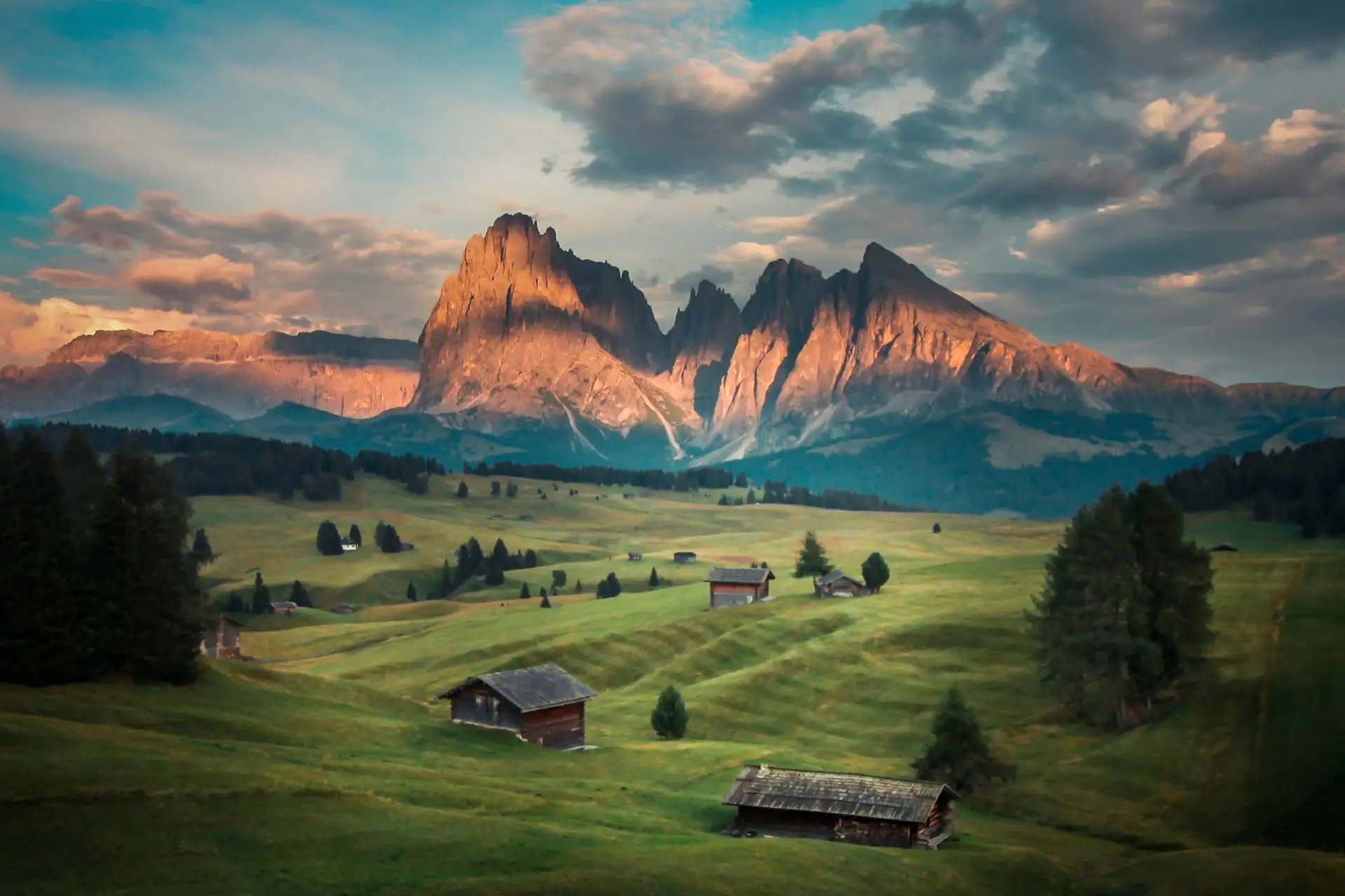 Seiser Alm with view of Sassolungo at sunset.