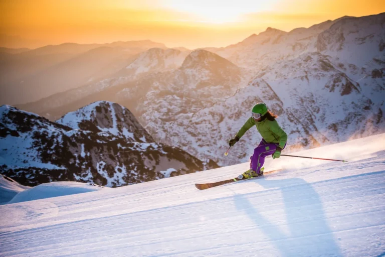 Skier carving on piste.