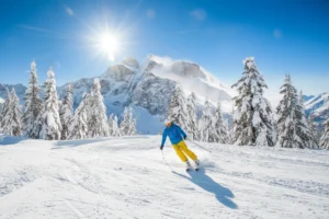 Skier cruising down the slopes.