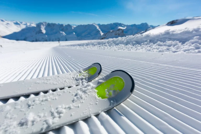Skies on fresh groomed piste.