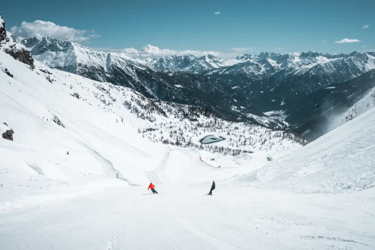 Skiing Pejo with a view of the Brenta Dolomites and the Adamello-Presanella Group.