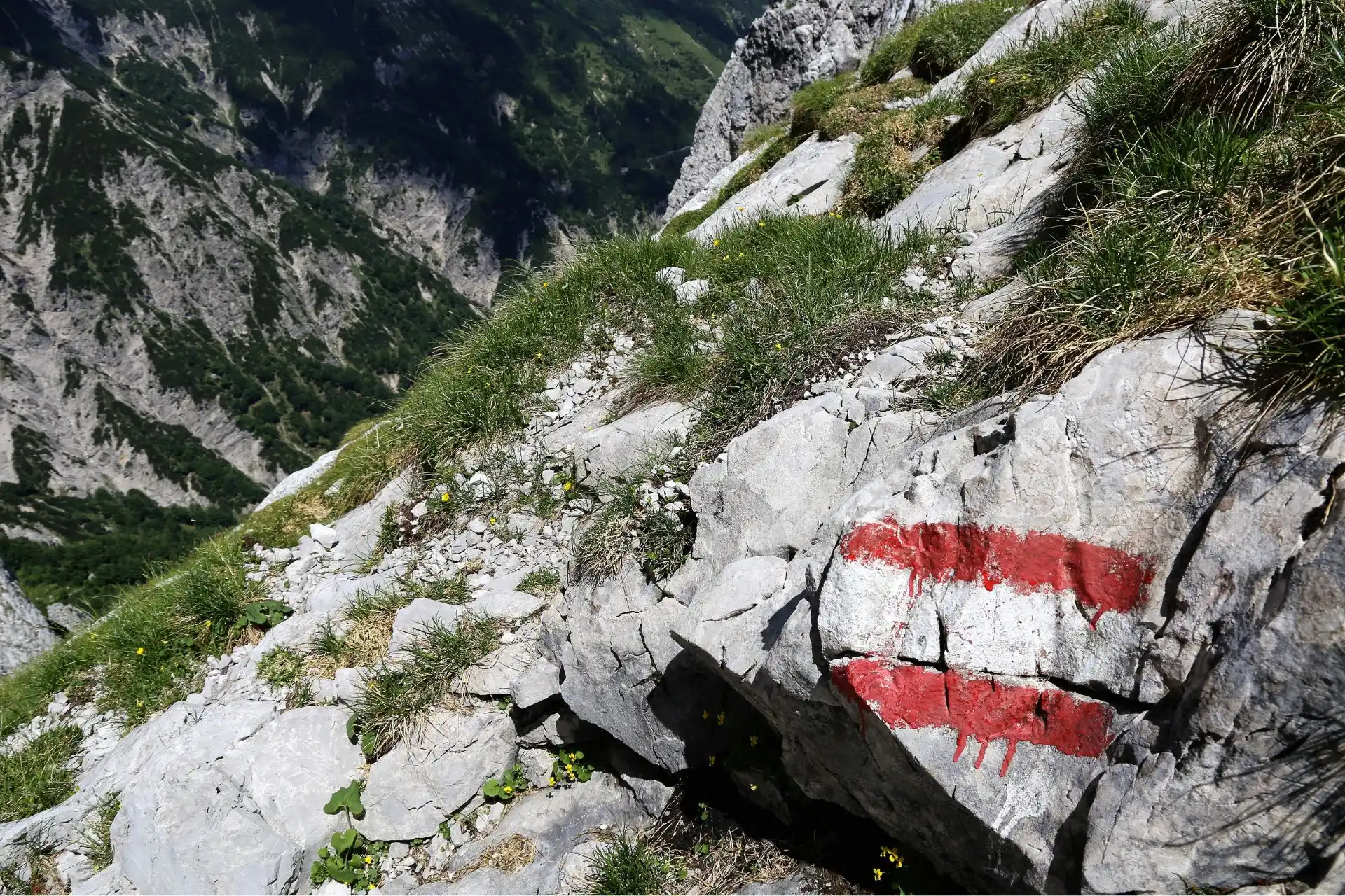 Typical red and white hiking route sign.