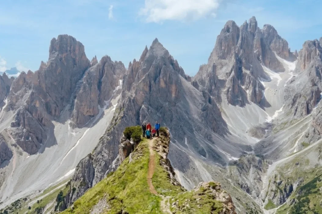 Hikers at the Cadini di Misurina lookout in summer.