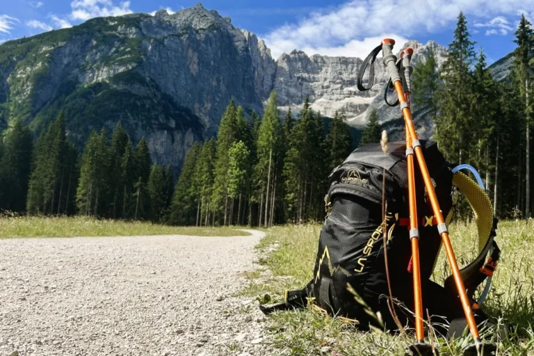Backpack and hiking poles - with a view of Sorapis from Valbona.