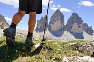 Hiker walking towards Tre Cime di Lavaredo North Face