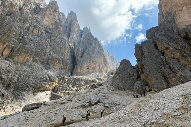Hikers coming down from Forcella Sassolungo.